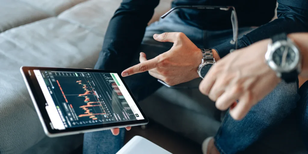 a tablet showing stocks prices